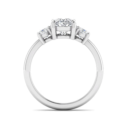 Oval cut three stone lab grown diamond engagement ring featuring an IGI certified center diamond with matching oval side diamonds in white gold.