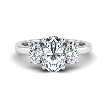 Oval cut three stone lab grown diamond engagement ring featuring an IGI certified center diamond with matching oval side diamonds in white gold.