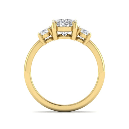 Oval cut three stone lab grown diamond engagement ring featuring an IGI certified center diamond with matching oval side diamonds in yellow gold.
