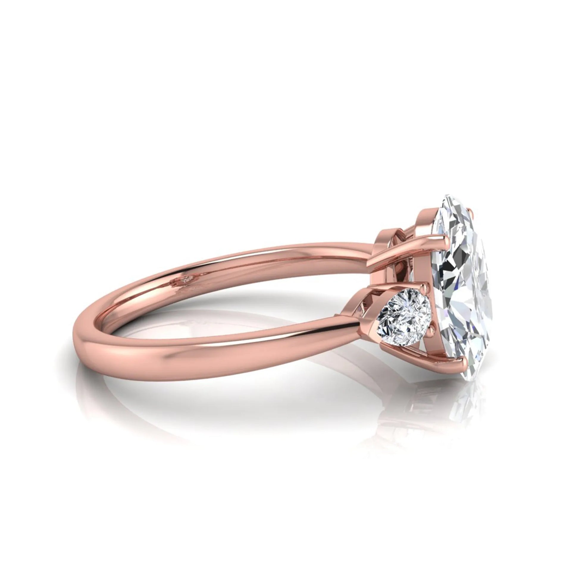 Oval three stone lab grown diamond engagement ring featuring a 1.86 carat IGI certified oval cut center diamond with pear cut side diamonds in a rose gold design.