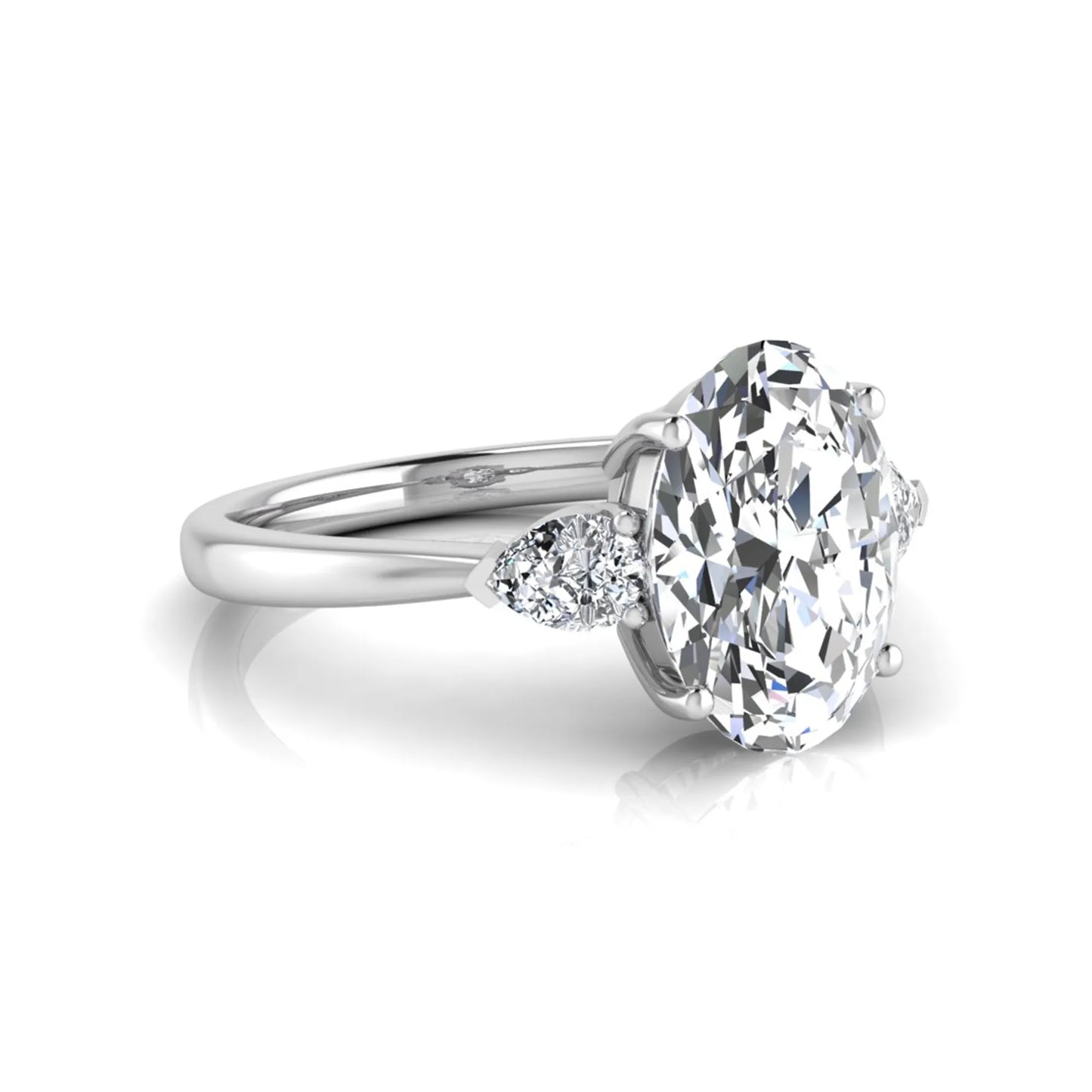 Oval three stone lab grown diamond engagement ring featuring a 1.86 carat IGI certified oval cut center diamond with pear cut side diamonds in a white gold design.