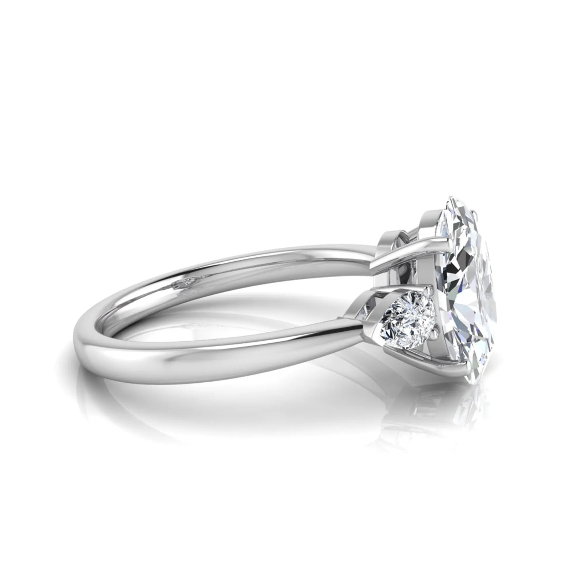 Oval three stone lab grown diamond engagement ring featuring a 1.86 carat IGI certified oval cut center diamond with pear cut side diamonds in a white gold design.