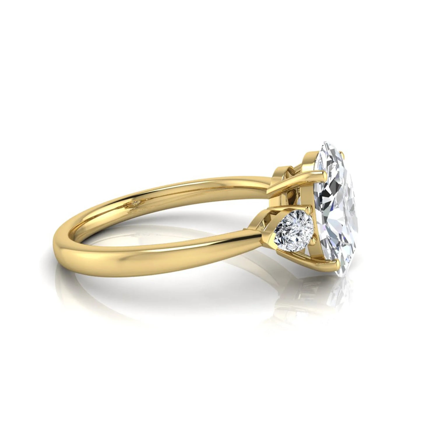 Oval three stone lab grown diamond engagement ring featuring a 1.86 carat IGI certified oval cut center diamond with pear cut side diamonds in a yellow gold design.