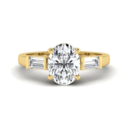 IGI Certified 1.86 carat oval cut lab grown diamond three stone engagement ring with baguette side diamonds in yellow gold.