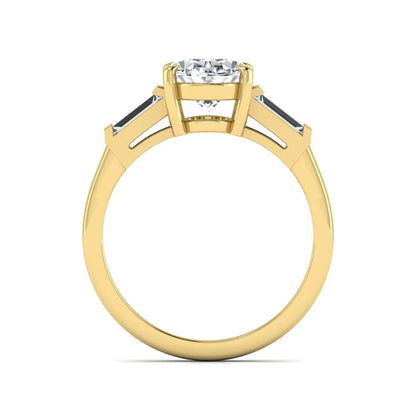 IGI Certified 1.86 carat oval cut lab grown diamond three stone engagement ring with baguette side diamonds in yellow gold.