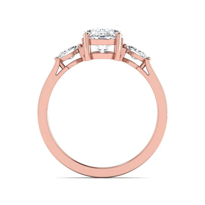 Oval cut lab grown diamond three stone engagement ring with marquise side diamonds in a prong setting featuring a rose gold tone design.