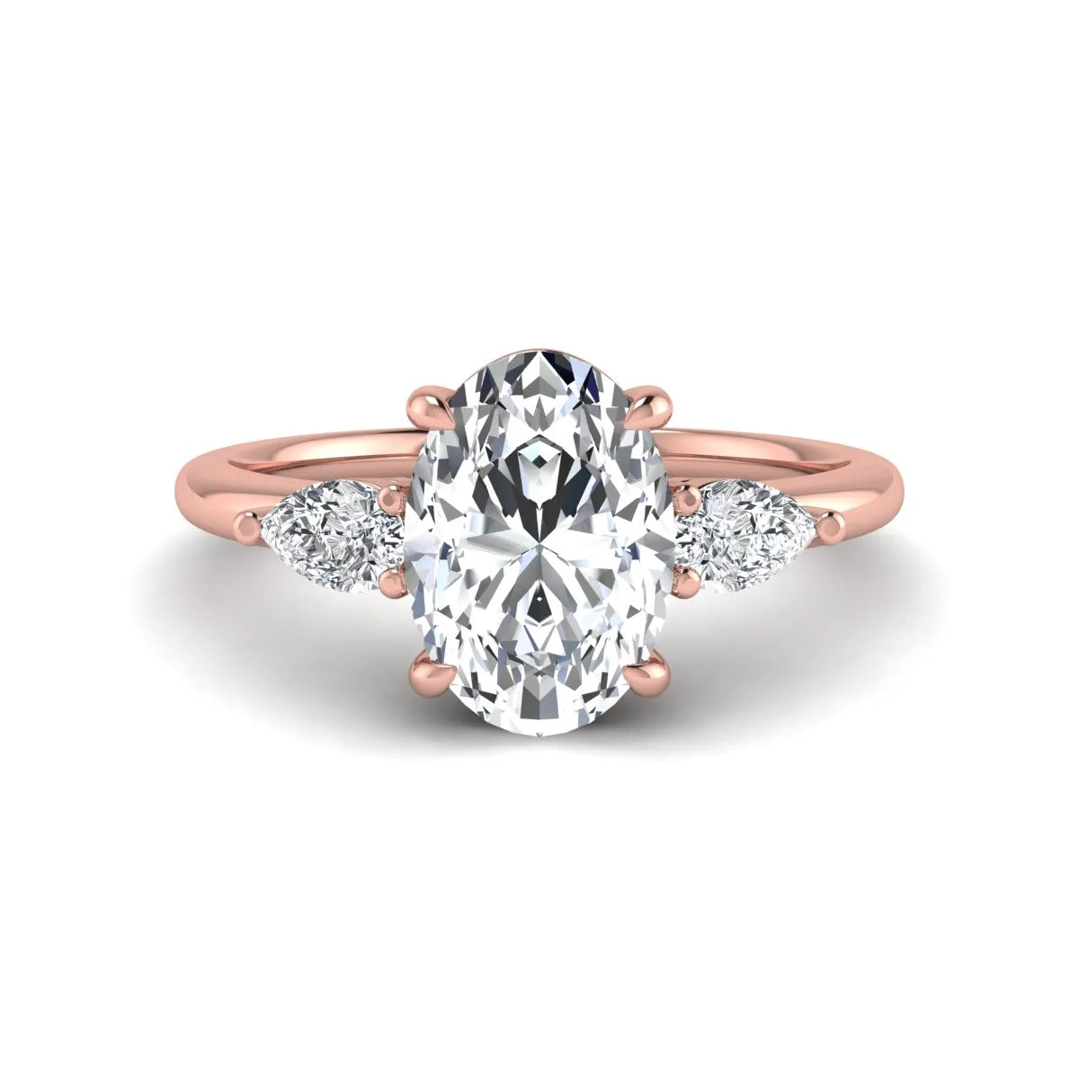 Oval cut lab grown diamond three stone engagement ring with pear side diamonds in a prong setting featuring a rose gold tone design.