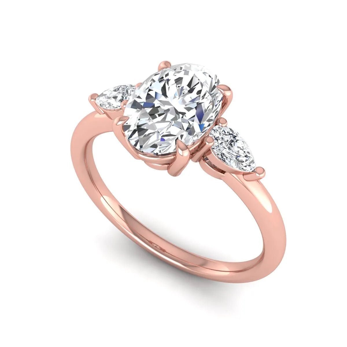 Oval cut lab grown diamond three stone engagement ring with pear side diamonds in a prong setting featuring a rose gold tone design.