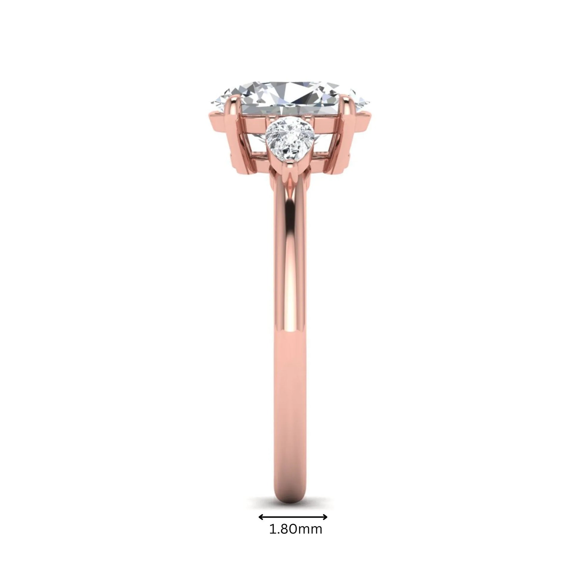 Oval cut lab grown diamond three stone engagement ring with pear side diamonds in a prong setting featuring a rose gold tone design.