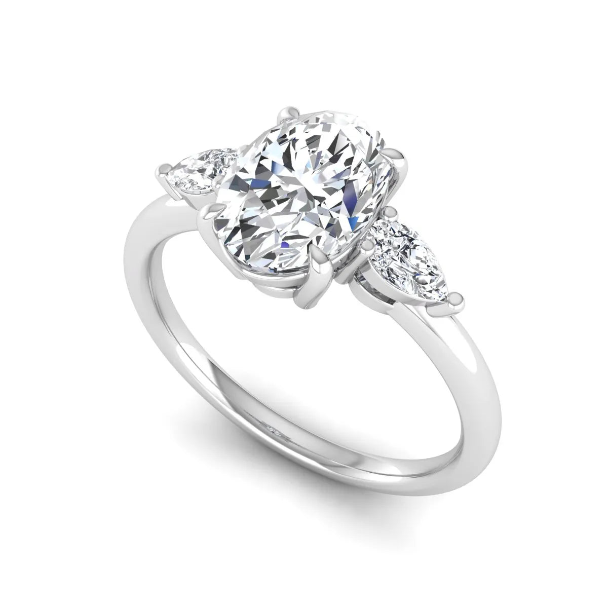 Oval cut lab grown diamond three stone engagement ring with pear side diamonds in a prong setting featuring a white gold tone design.