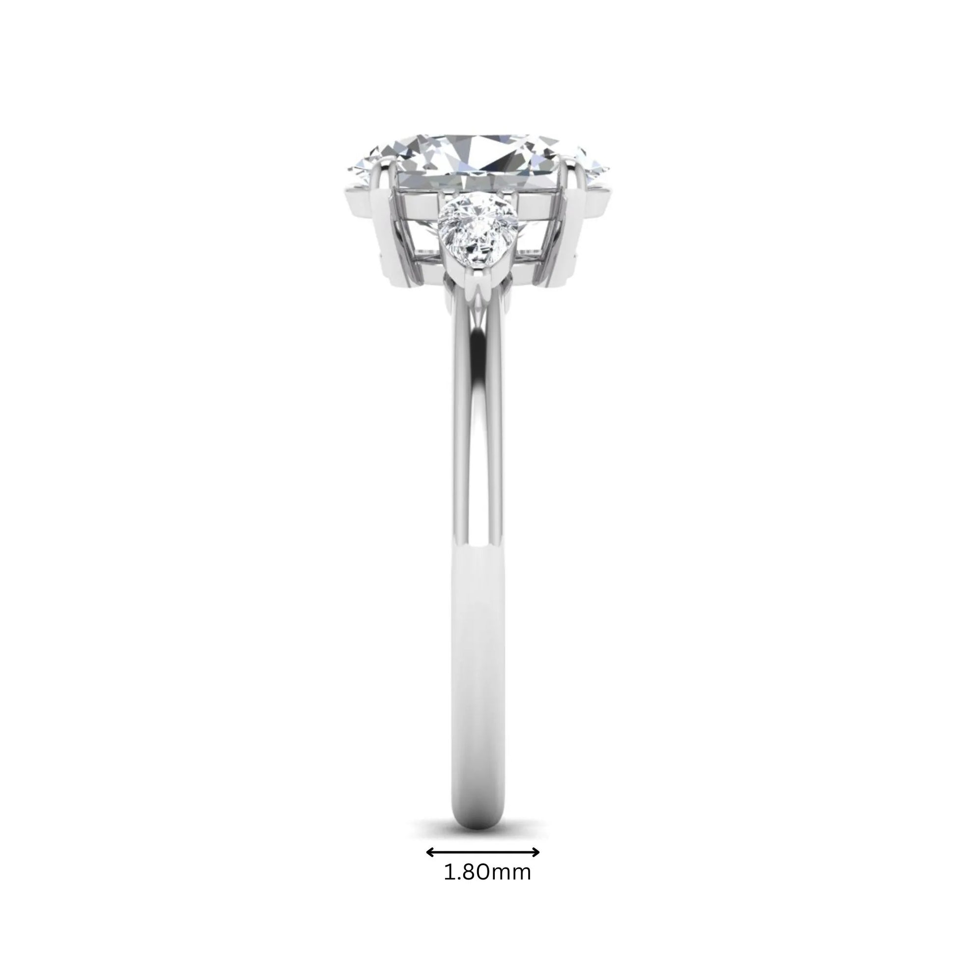 Oval cut lab grown diamond three stone engagement ring with pear side diamonds in a prong setting featuring a white gold tone design.