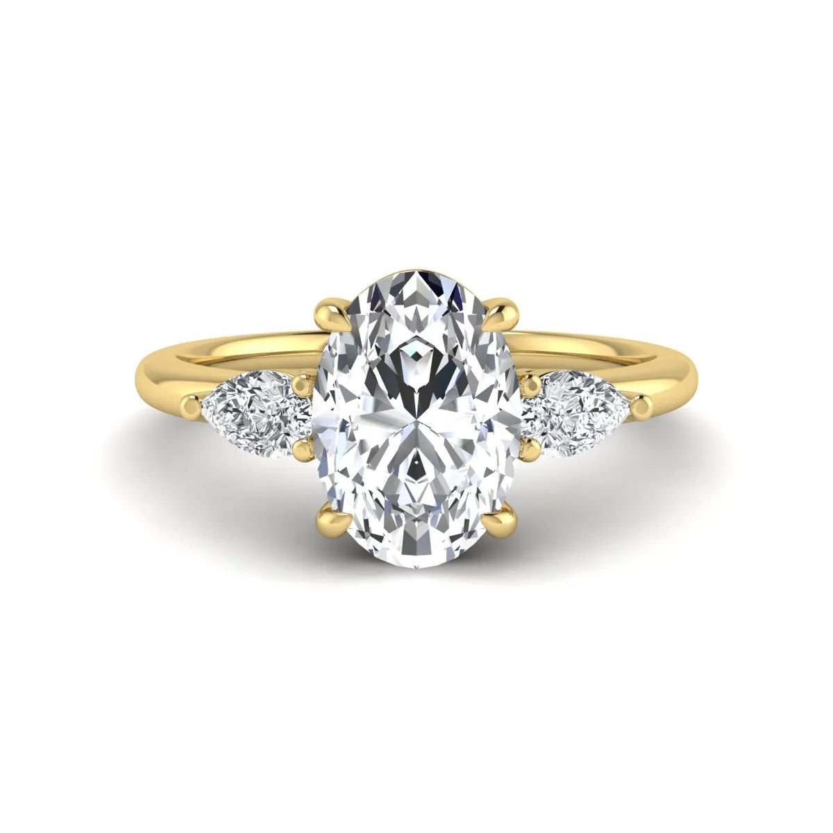 Oval cut lab grown diamond three stone engagement ring with pear side diamonds in a prong setting featuring a yellow gold tone design.