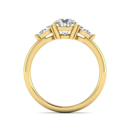 Oval cut lab grown diamond three stone engagement ring with pear side diamonds in a prong setting featuring a yellow gold tone design.
