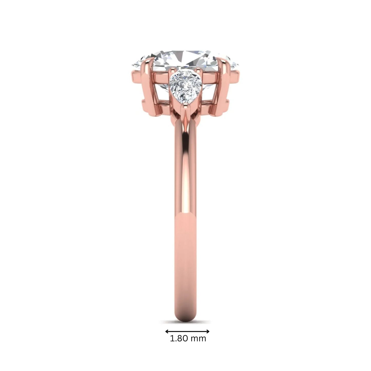 Oval cut lab grown diamond three stone engagement ring with pear cut side diamonds in a prong setting on a polished rose gold band.
