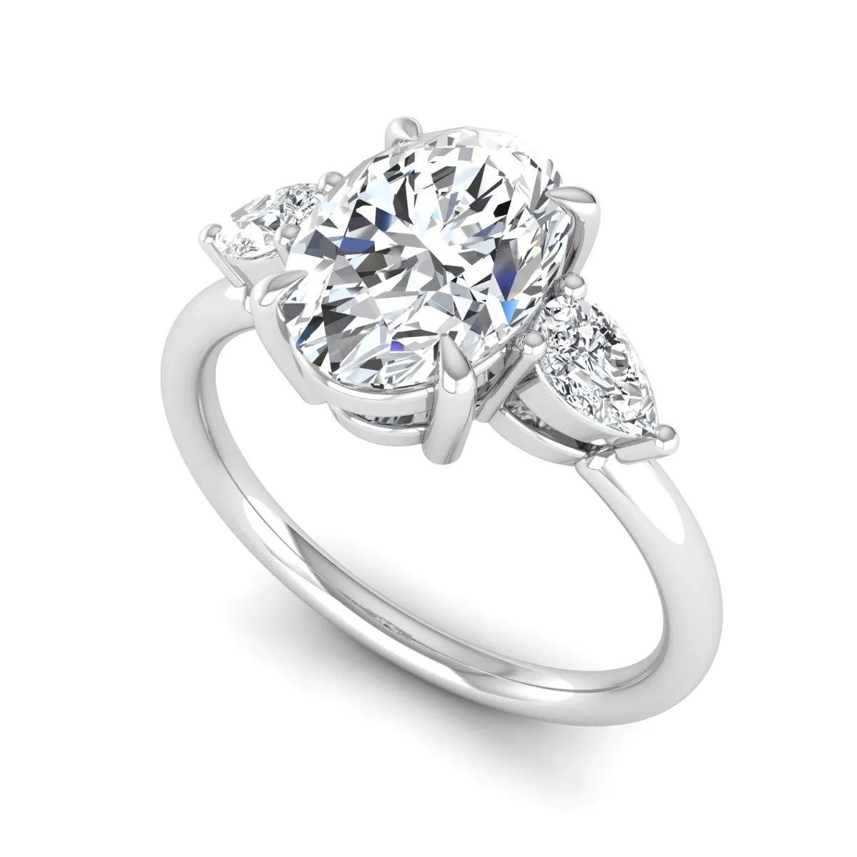 Oval cut lab grown diamond three stone engagement ring with pear cut side diamonds in a prong setting on a polished white gold band.