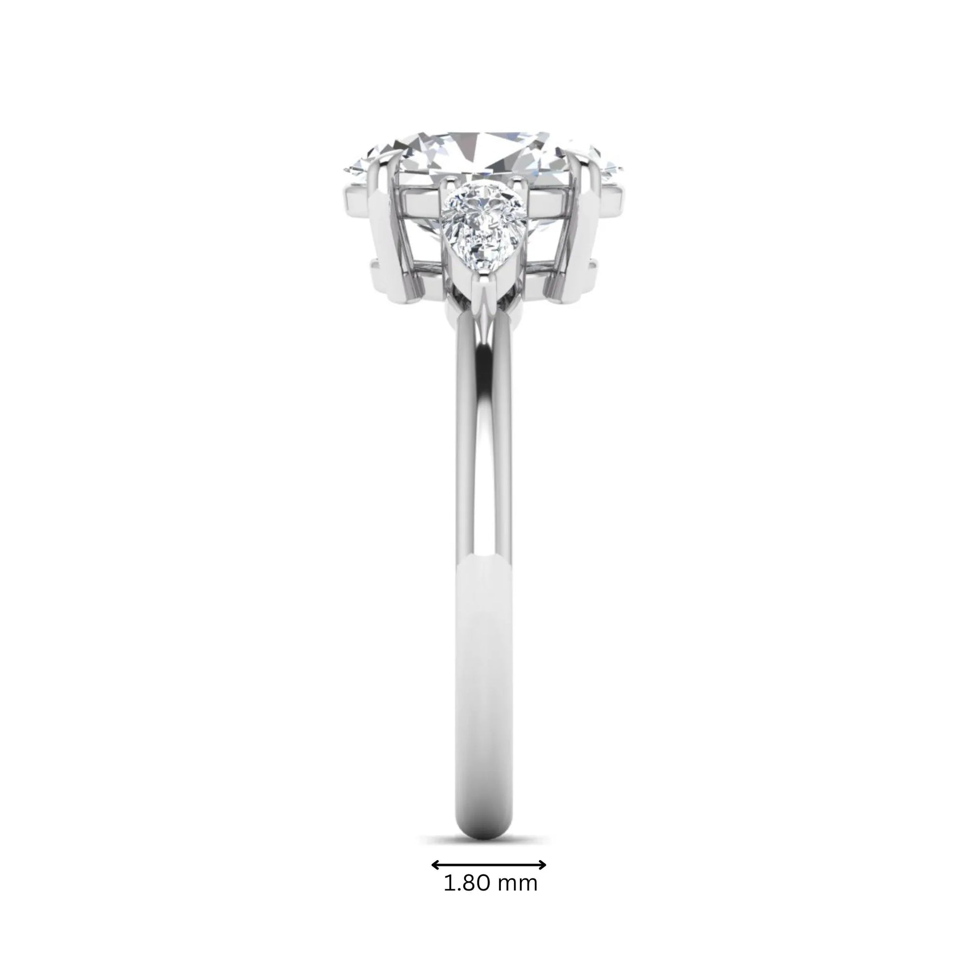 Oval cut lab grown diamond three stone engagement ring with pear cut side diamonds in a prong setting on a polished white gold band.