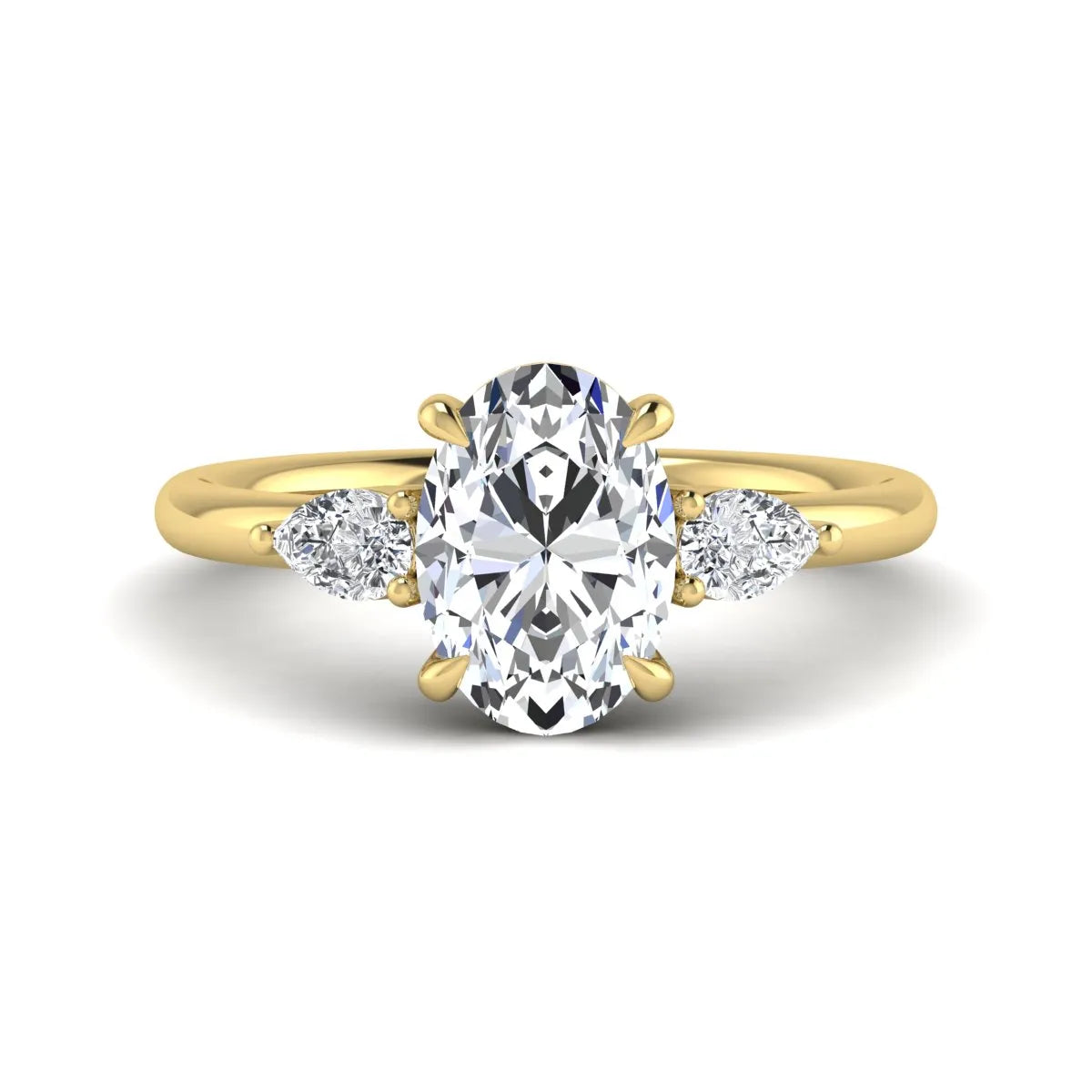 Oval cut lab grown diamond three stone engagement ring with pear cut side diamonds in a prong setting on a polished yellow gold band.