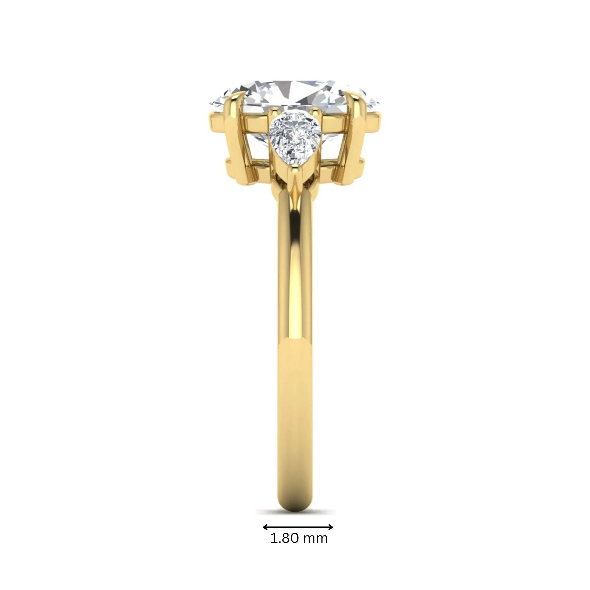 Oval cut lab grown diamond three stone engagement ring with pear cut side diamonds in a prong setting on a polished yellow gold band.