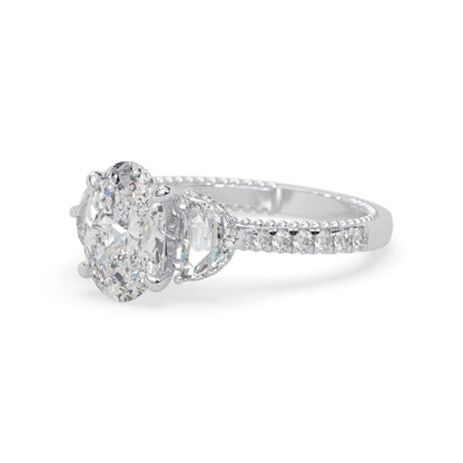 Oval three stone pavé lab grown diamond engagement ring with round and half moon side diamonds in white gold