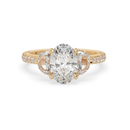 Oval three stone pavé lab grown diamond engagement ring with round and half moon side diamonds in yellow gold