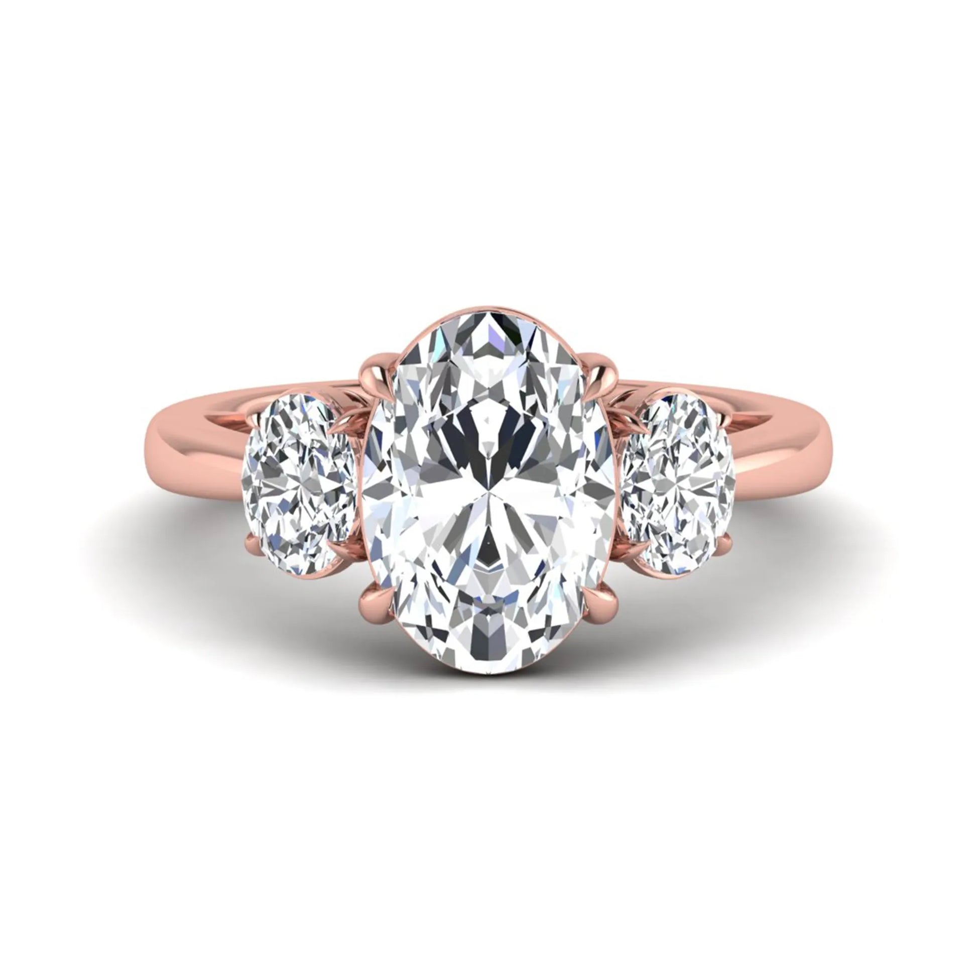 Oval three stone prong set lab grown diamond engagement ring featuring a 3.00 carat oval center diamond with matching oval side diamonds in rose gold finish.
