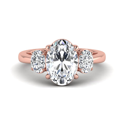 Oval three stone prong set lab grown diamond engagement ring featuring a 3.00 carat oval center diamond with matching oval side diamonds in rose gold finish.