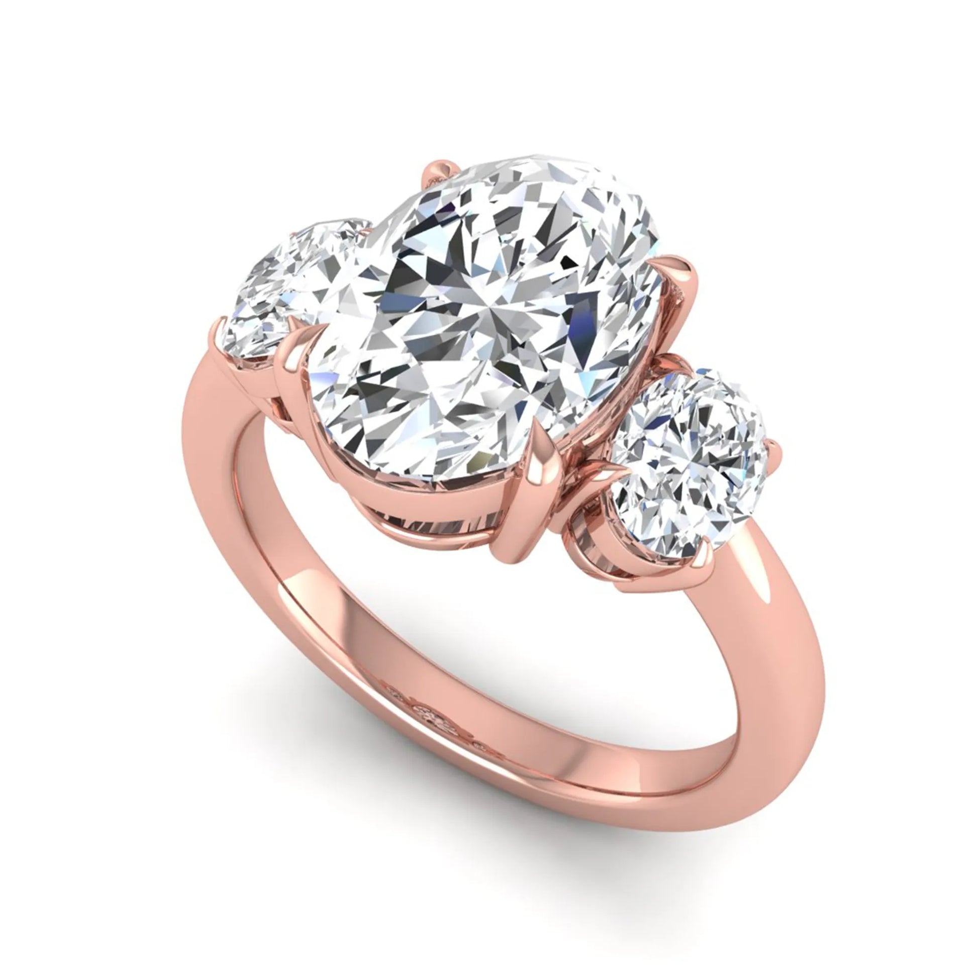 Oval three stone prong set lab grown diamond engagement ring featuring a 3.00 carat oval center diamond with matching oval side diamonds in rose gold finish.