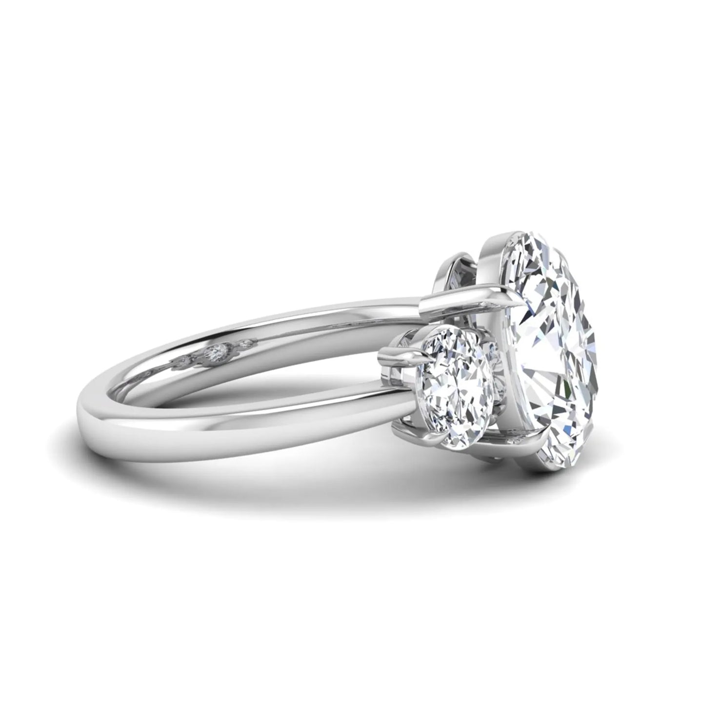 Oval three stone prong set lab grown diamond engagement ring featuring a 3.00 carat oval center diamond with matching oval side diamonds in white gold finish.
