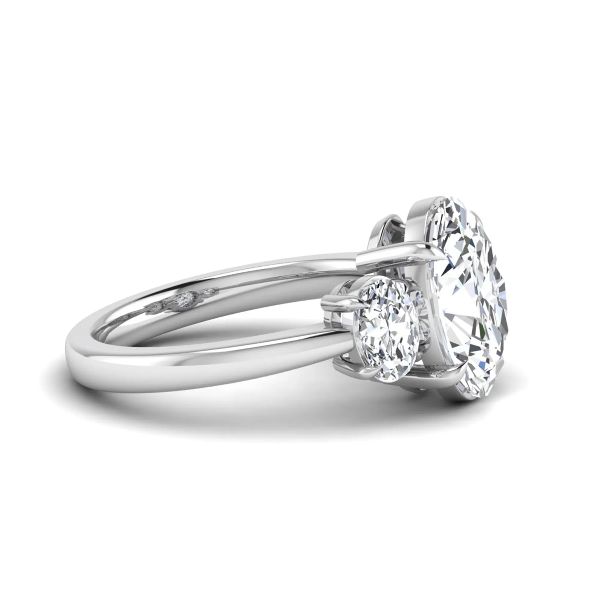 Oval three stone prong set lab grown diamond engagement ring featuring a 3.00 carat oval center diamond with matching oval side diamonds in white gold finish.