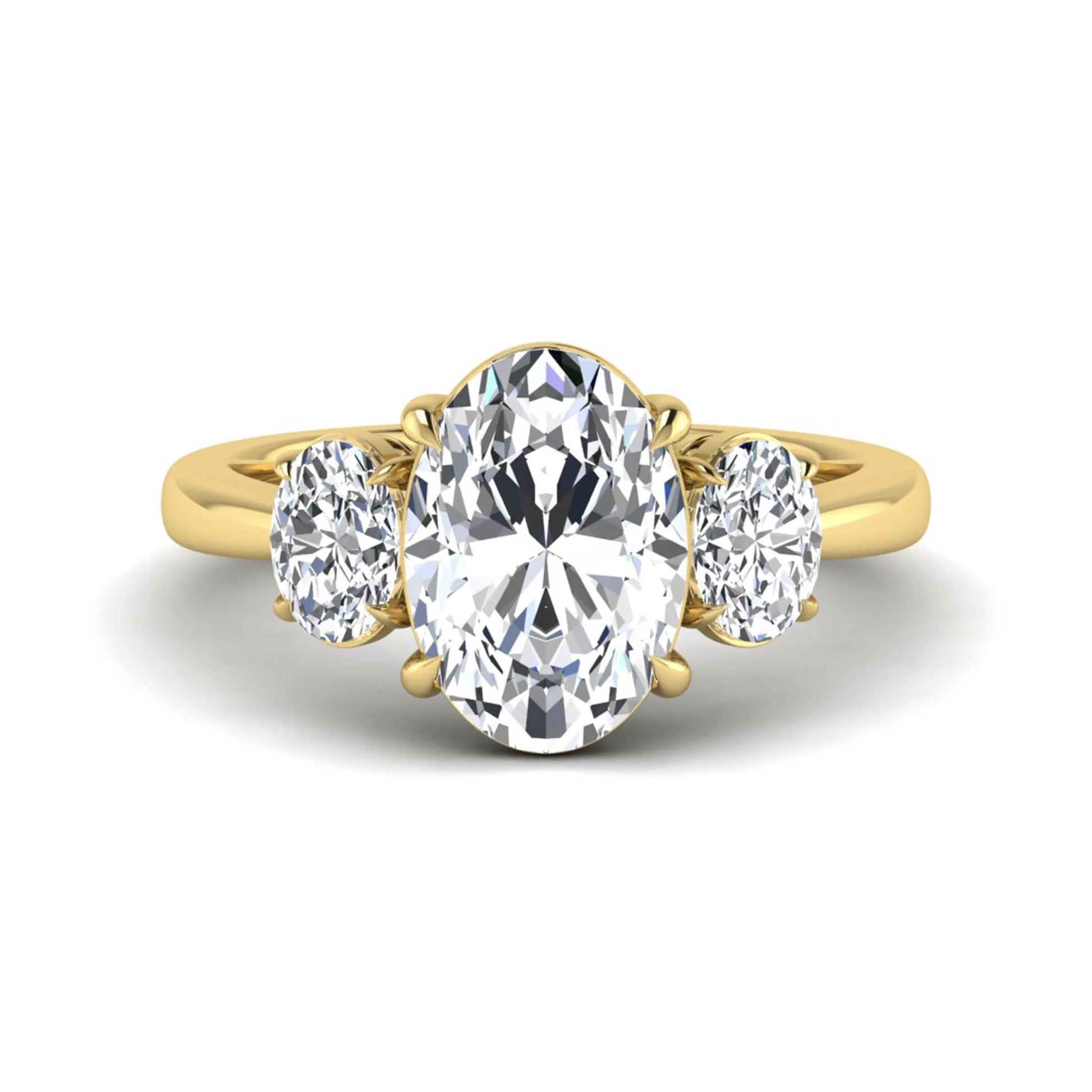 Oval three stone prong set lab grown diamond engagement ring featuring a 3.00 carat oval center diamond with matching oval side diamonds in yellow gold finish.