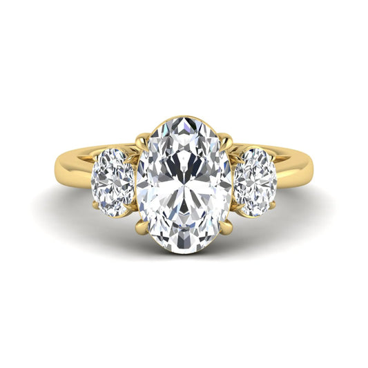 Oval three stone prong set lab grown diamond engagement ring featuring a 3.00 carat oval center diamond with matching oval side diamonds in yellow gold finish.