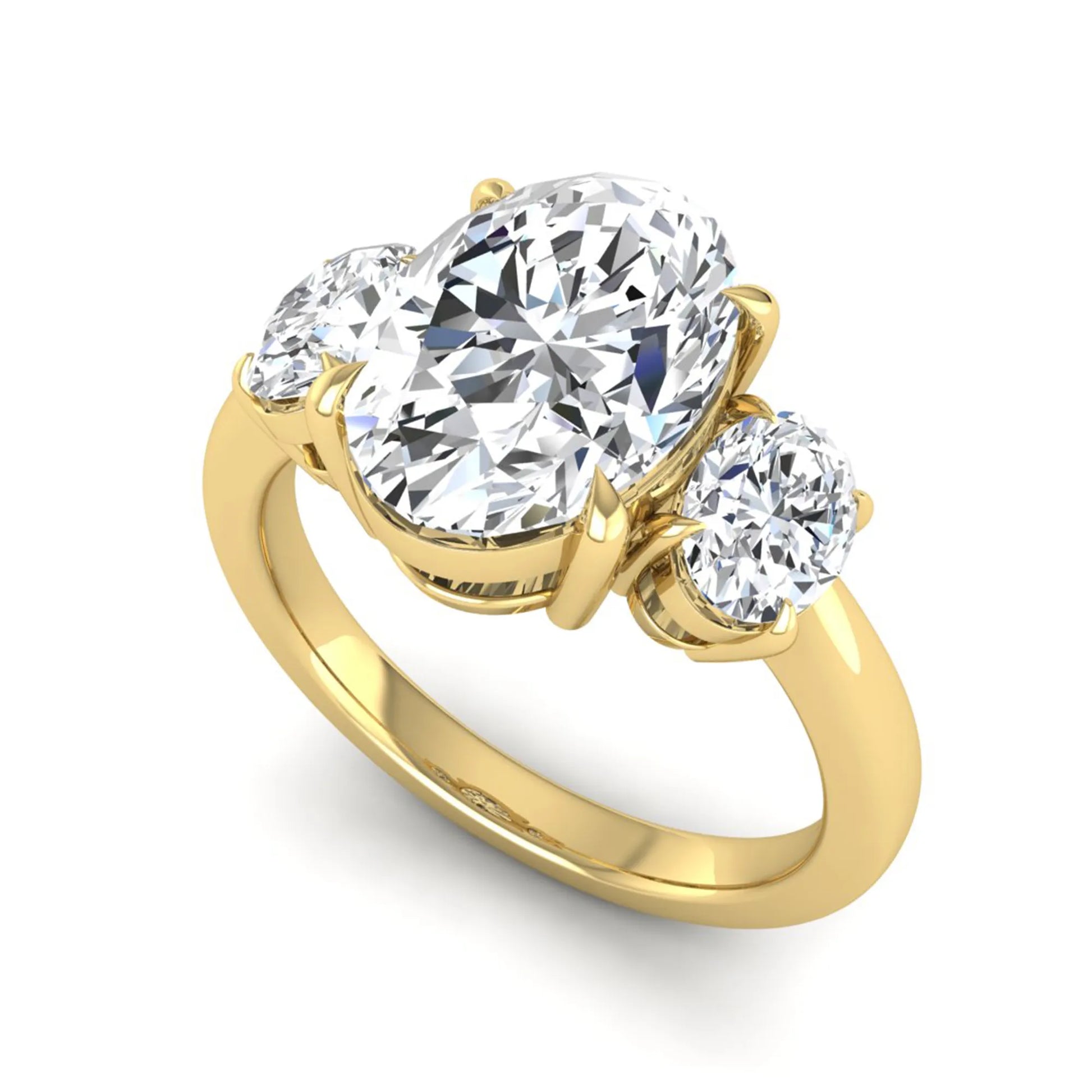 Oval three stone prong set lab grown diamond engagement ring featuring a 3.00 carat oval center diamond with matching oval side diamonds in yellow gold finish.