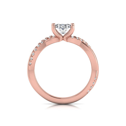 Oval cut lab grown diamond engagement ring featuring a 1.21 carat center diamond in a four-prong setting with a twisted pavé accent band and polished rose gold finish.