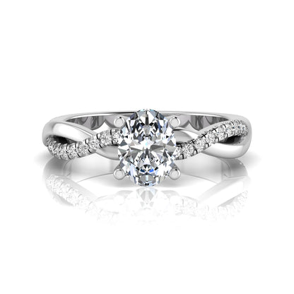 Oval cut lab grown diamond engagement ring featuring a 1.21 carat center diamond in a four-prong setting with a twisted pavé accent band and polished white gold finish.