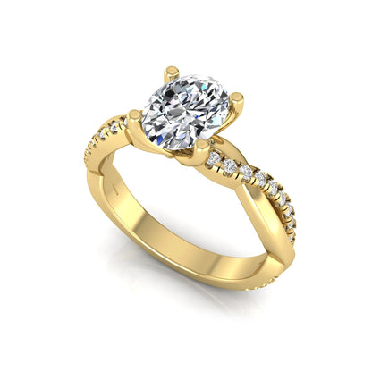 Oval cut lab grown diamond engagement ring featuring a 1.21 carat center diamond in a four-prong setting with a twisted pavé accent band and polished yellow gold finish.