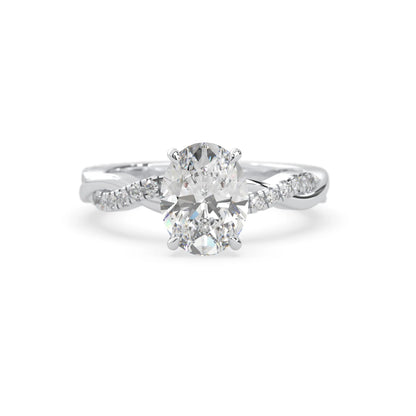 oval brilliant lab grown diamond engagement ring with prong setting and twisted pavé diamond band in white gold tone