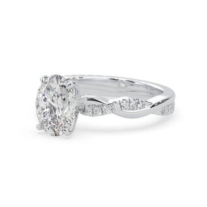 oval brilliant lab grown diamond engagement ring with prong setting and twisted pavé diamond band in white gold tone