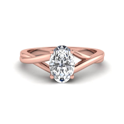 Oval twisted shank solitaire lab grown diamond engagement ring featuring a 1.50 carat IGI certified oval cut diamond in a rose gold setting.