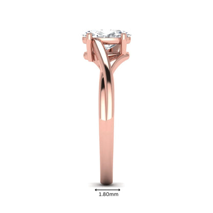 Oval twisted shank solitaire lab grown diamond engagement ring featuring a 1.50 carat IGI certified oval cut diamond in a rose gold setting.