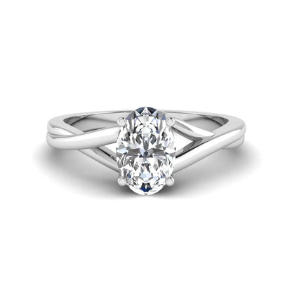 Oval twisted shank solitaire lab grown diamond engagement ring featuring a 1.50 carat IGI certified oval cut diamond in a white gold setting.