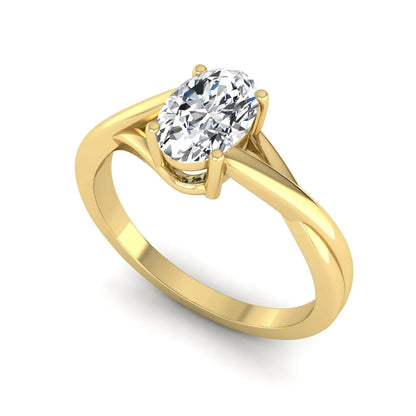 Oval twisted shank solitaire lab grown diamond engagement ring featuring a 1.50 carat IGI certified oval cut diamond in a yellow gold setting.