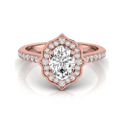 Oval cut lab grown diamond engagement ring featuring a vintage-inspired scalloped halo, pavé diamond band, and rose gold tone setting.