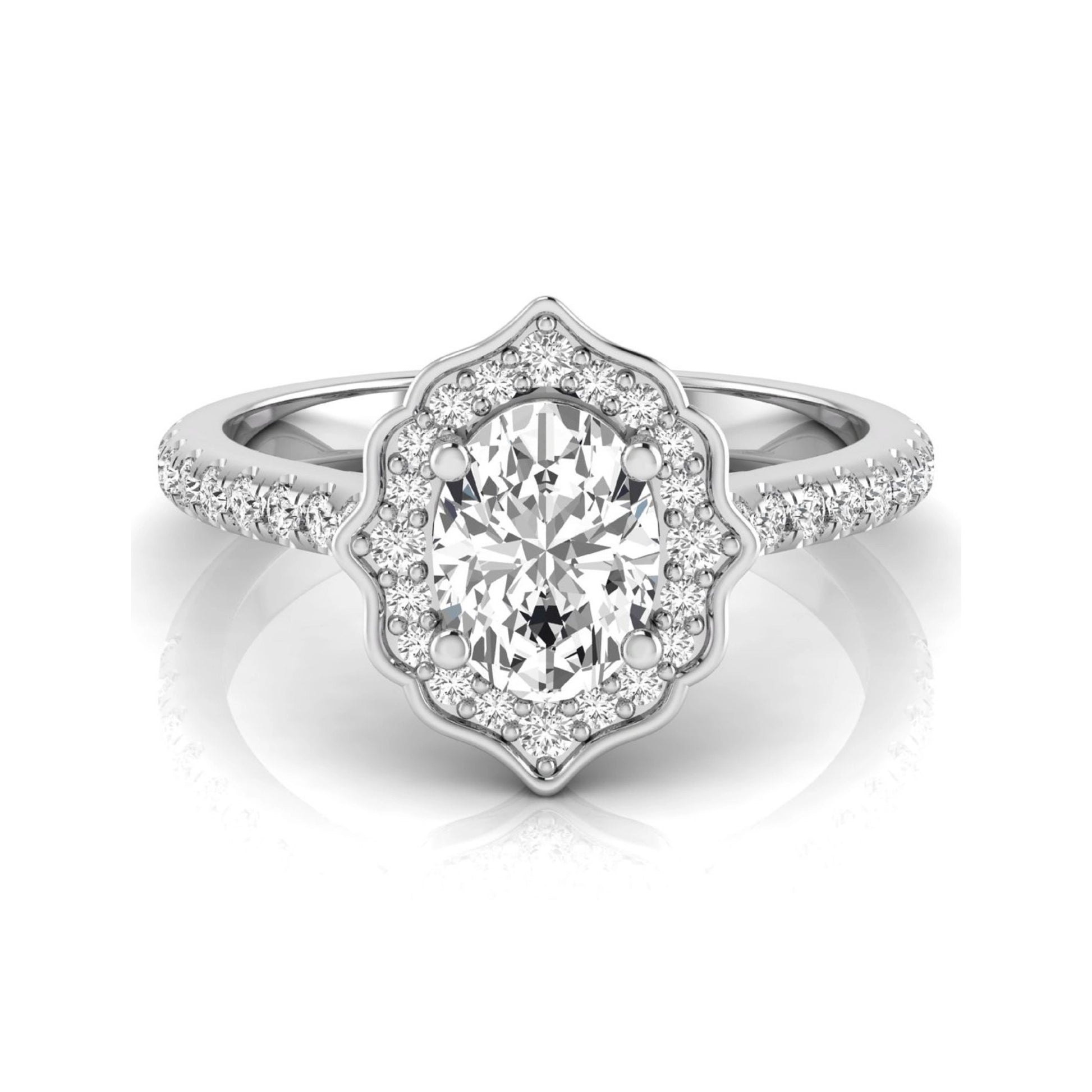 Oval cut lab grown diamond engagement ring featuring a vintage-inspired scalloped halo, pavé diamond band, and white gold tone setting.