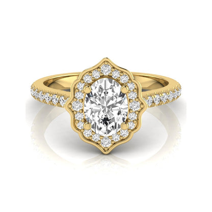 Oval cut lab grown diamond engagement ring featuring a vintage-inspired scalloped halo, pavé diamond band, and yellow gold tone setting.