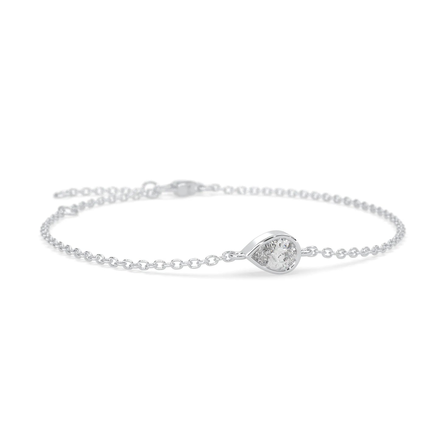 Pear cut lab grown diamond bezel set solitaire bracelet with delicate chain and lobster clasp in white gold tone.