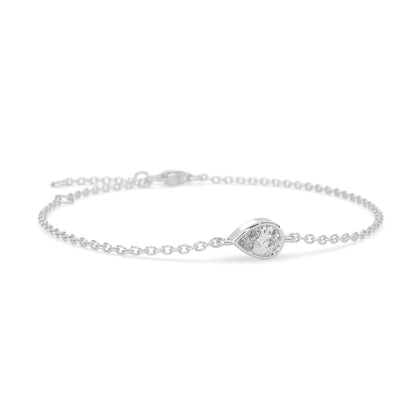 Pear cut lab grown diamond bezel set solitaire bracelet with delicate chain and lobster clasp in white gold tone.