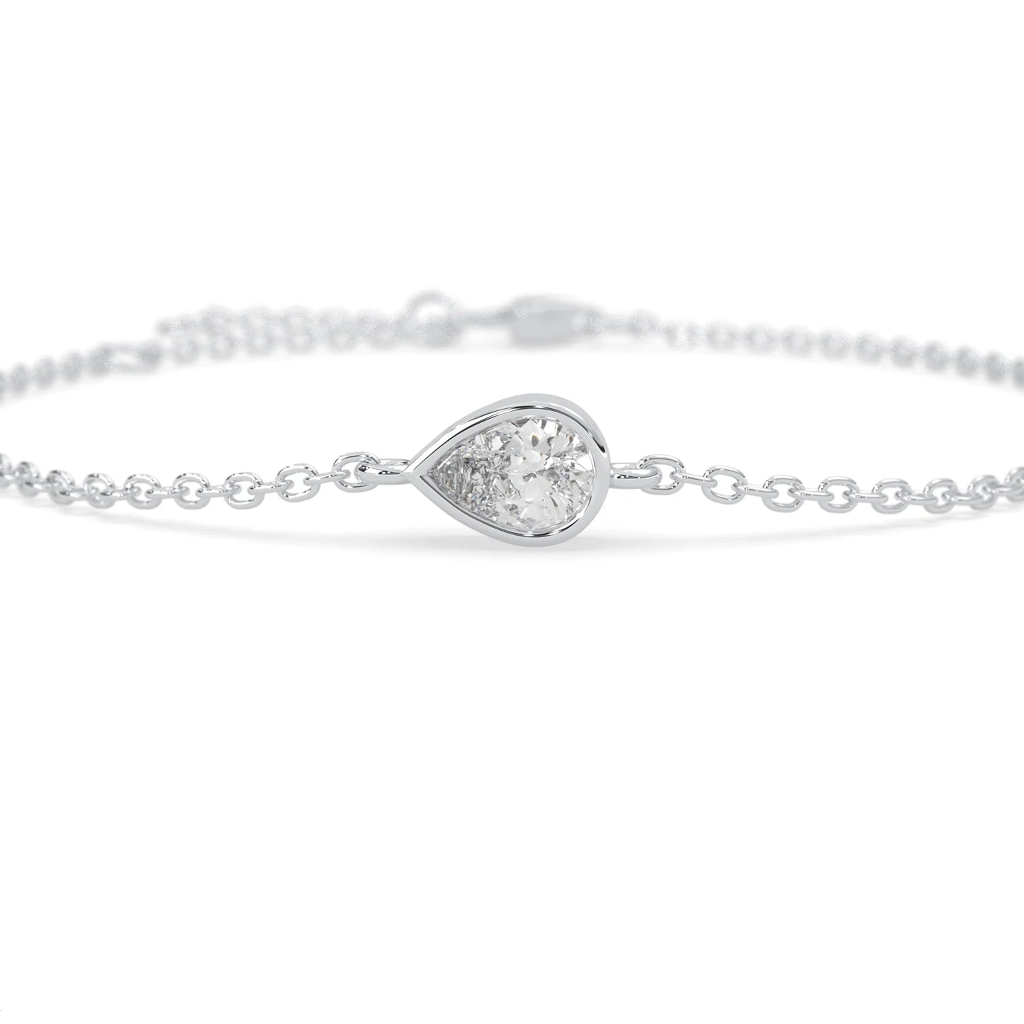 Pear cut lab grown diamond bezel set solitaire bracelet with delicate chain and lobster clasp in white gold tone.
