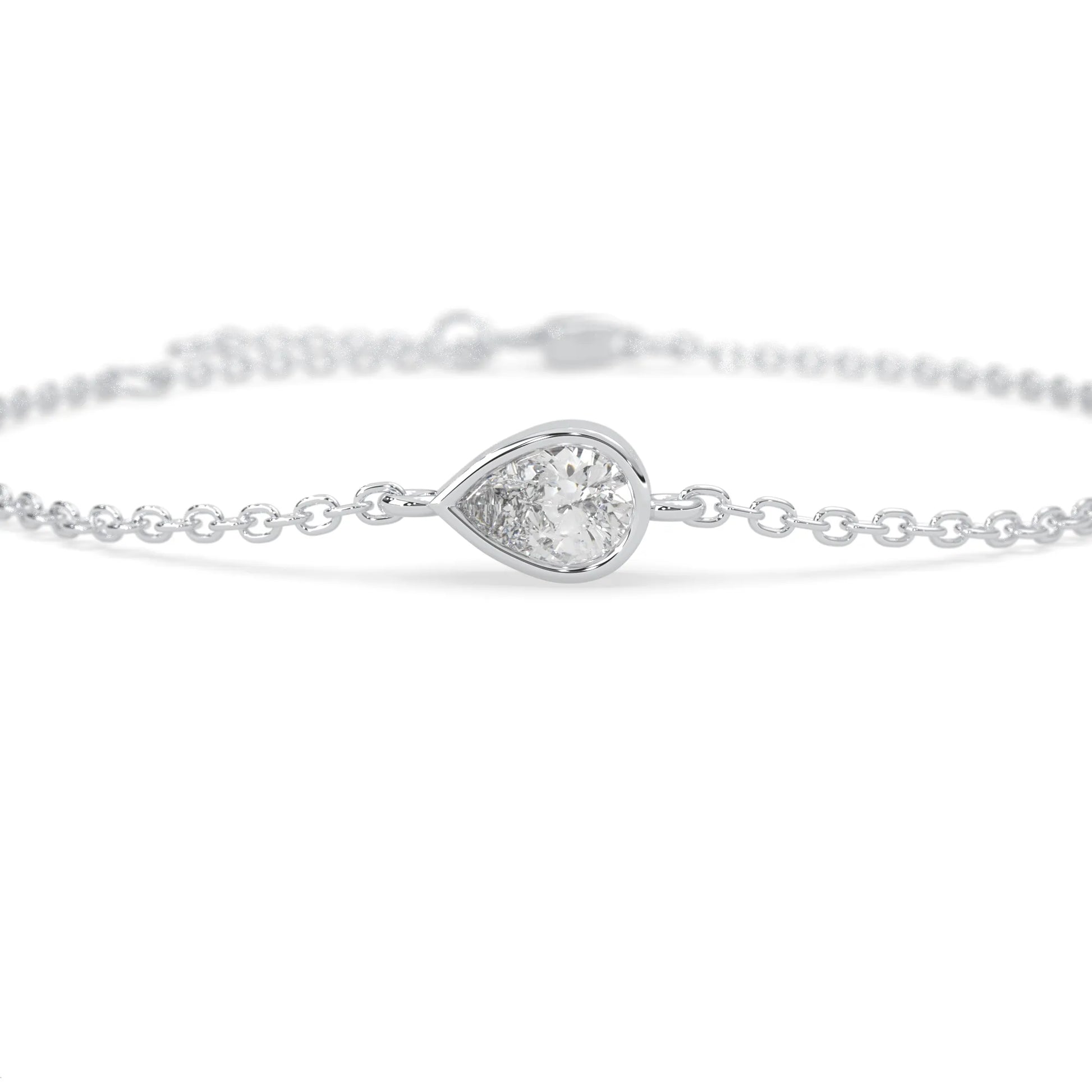 Pear cut lab grown diamond bezel set solitaire bracelet with delicate chain and lobster clasp in white gold tone.