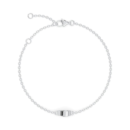 Pear cut lab grown diamond bezel set solitaire bracelet with delicate chain and lobster clasp in white gold tone.