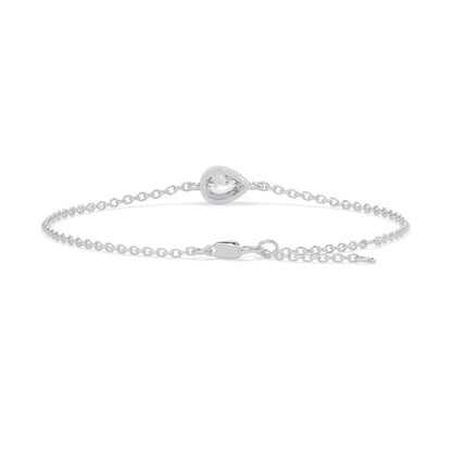 Pear cut lab grown diamond bezel set solitaire bracelet with delicate chain and lobster clasp in white gold tone.
